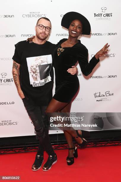 Marcell Von Berlin and Nikeata Thompson during the Marcell Von Berlin 'Genesis' collection presentation on July 3, 2017 in Berlin, Germany.