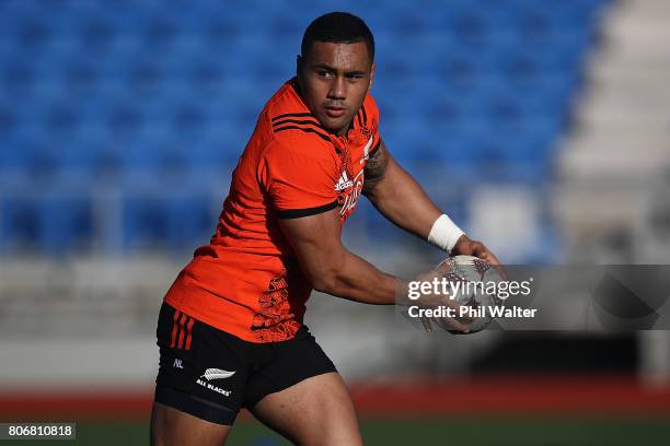 Ngani Laumape of the All Blacks passes during a New Zealand All Blacks training session at Trusts Stadium on July 4, 2017 in Auckland, New Zealand.