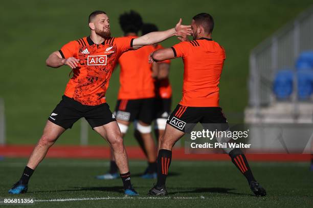 Tawera Kerr-Barlow and Aaron Cruden of the All Blacks during a New Zealand All Blacks training session at Trusts Stadium on July 4, 2017 in Auckland,...