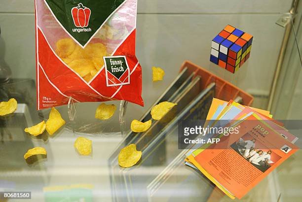 Chips packet is displayed next to a flyer featuring Swedish pop group ABBA in the exhibition "Snap! Towards the cultural history of a snack", which...