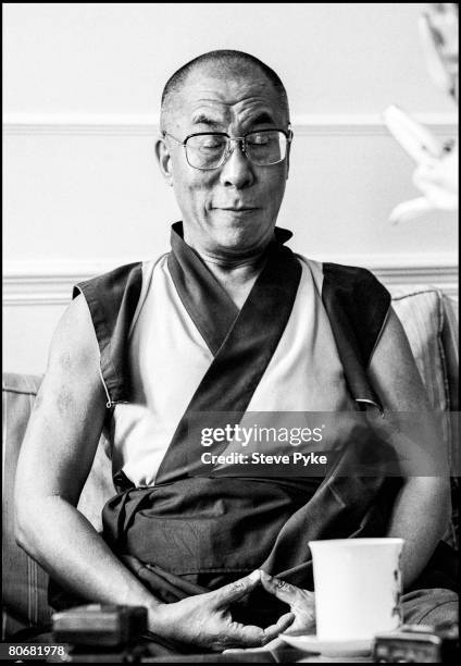 Tenzin Gyatso, the 14th Dalai Lama, in meditative pose, circa 1996.