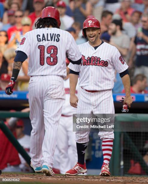 Daniel Nava of the Philadelphia Phillies reacts after a two-run home run off the at of Freddy Galvis of the Philadelphia Phillies in the bottom of...