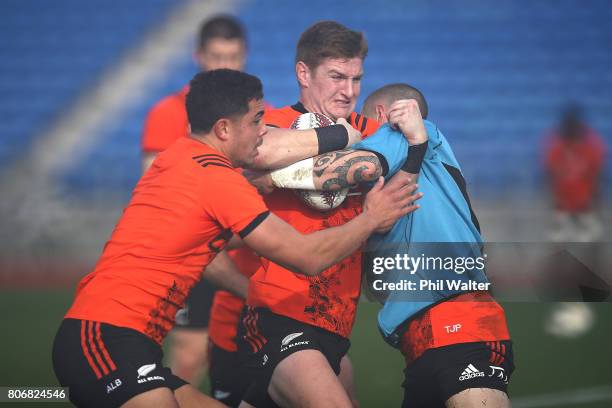 Jordie Barrett of the All Blacks is tackled during a New Zealand All Blacks training session at Trusts Stadium on July 4, 2017 in Auckland, New...