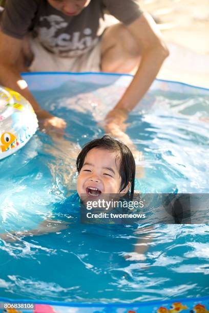 asian toddler learn to swim. - floating on water stock pictures, royalty-free photos & images