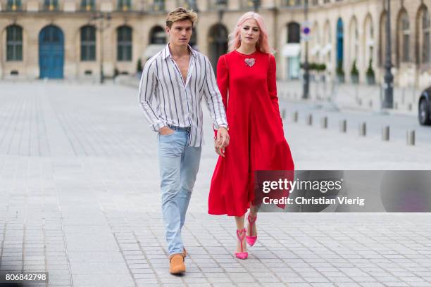 Oliver Cheshire and Pixie Lott wearing a red dress outside Schiaparelli during Paris Fashion Week - Haute Couture Fall/Winter 2017-2018 : Day Two on...