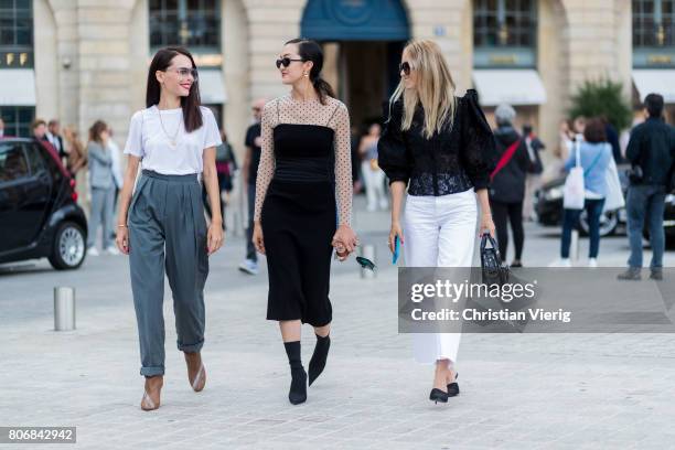 Evangeline Smyrotaki; Chriselle Lim; Charlotte Groeneveld outside Schiaparelli during Paris Fashion Week - Haute Couture Fall/Winter 2017-2018 : Day...