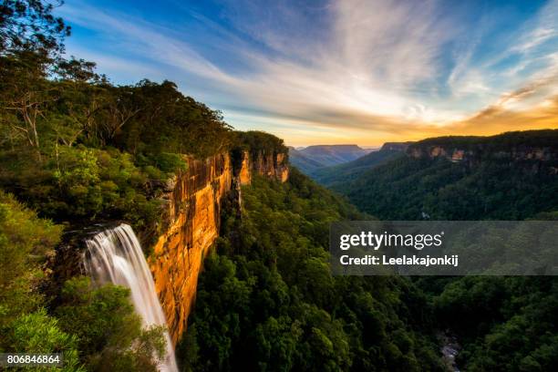 sunset from fitzroy falls - australian waterfalls stock pictures, royalty-free photos & images
