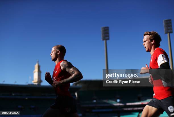 Zak Jones and Callum Mills of the Swans run laps during a Sydney Swans AFL training session at Sydney Cricket Ground on July 4, 2017 in Sydney,...