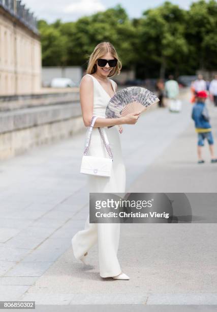 Elena Perminova outside Dior during Paris Fashion Week - Haute Couture Fall/Winter 2017-2018 : Day Two on July 3, 2017 in Paris, France.