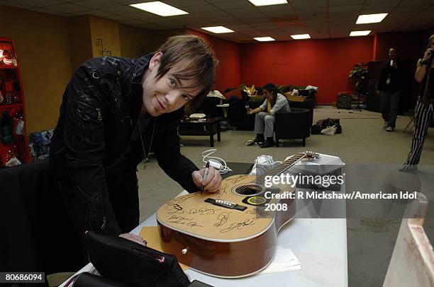 American Idol Contestant David Cook poses for pictures behind the scenes on March 11, 2008 in Los Angeles, California. Before the top 12 contestants...