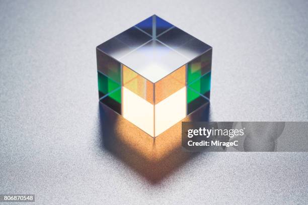 cube prism on metallic background - プリズム　レンズ ストックフォトと画像