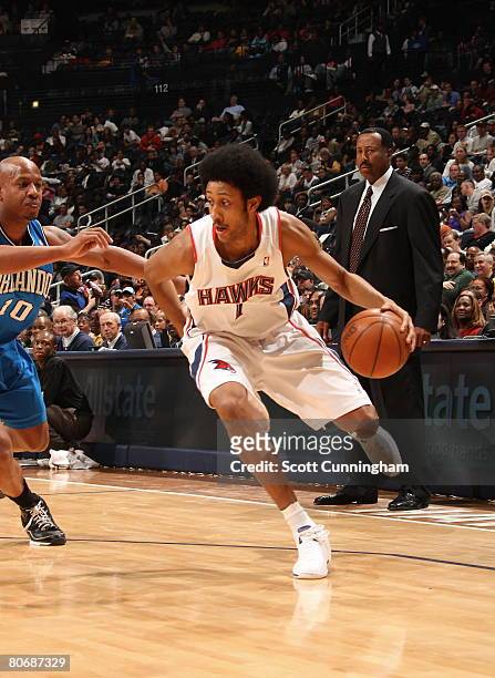 Josh Childress of the Atlanta Hawks drives to the basket against Keith Bogans of the Orlando Magic at Philips Arena on April 15, 2008 in Atlanta,...
