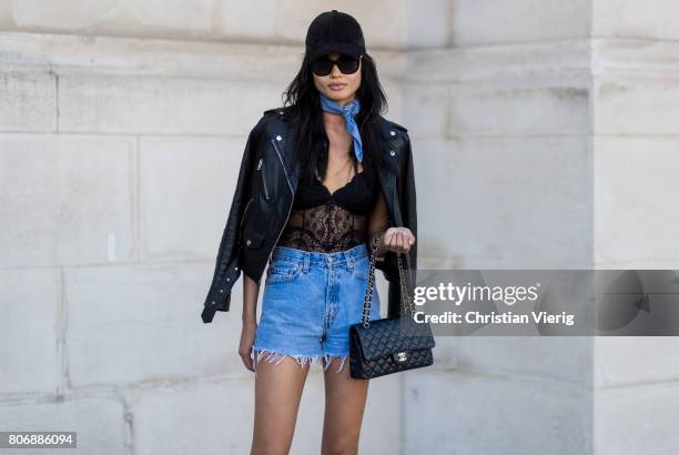 Model Daniela Braga wearing scarf, black hat, denim shorts, leather jacket outside Ralph & Russo during Paris Fashion Week - Haute Couture...