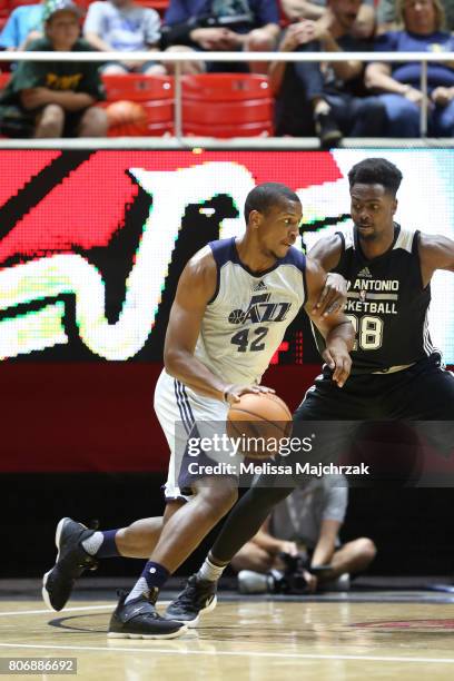 Jonathan Holmes of the Utah Jazz drives to the basket against the San Antonio Spurs on July 3, 2017 at Jon M. Huntsman Center in Salt Lake City,...