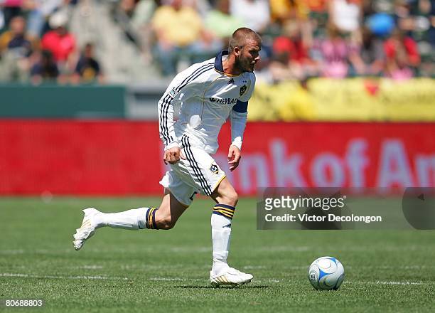 David Beckham of the Los Angeles Galaxy moves the ball across midfield in the second half against Toronto FC during their MLS game at the Home Depot...
