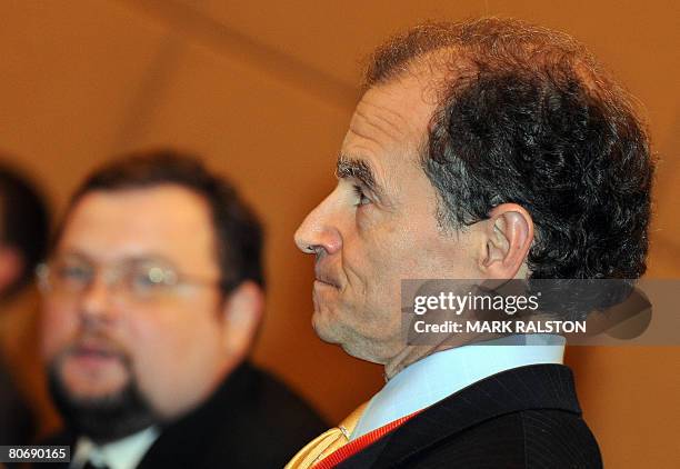 The head of the US delegation, Daniel Fried , is watched by his Russian counterpart Sergei Kislyak during their meeting on the Iranian nuclear issue...