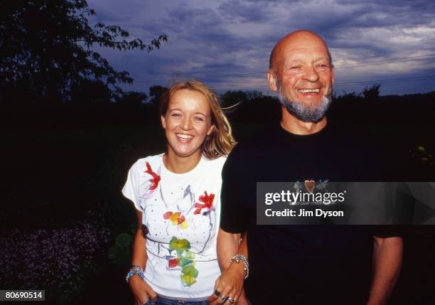 Glastonbury festival organiser Michael Eavis and daughter Emily pose in their garden at Worthy Farm in April 2002 in Pilton, Somerset, England.