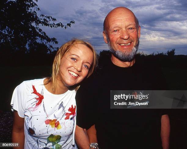 Glastonbury festival organiser Michael Eavis and daughter Emily pose in their garden at Worthy Farm in April 2002 in Pilton, Somerset, England.