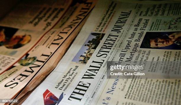 Copy of the U.S. Edition of The Wall Street Journal lies next to a copy of The Financial Times newspaper on a news stand on April 16, 2008 in London,...