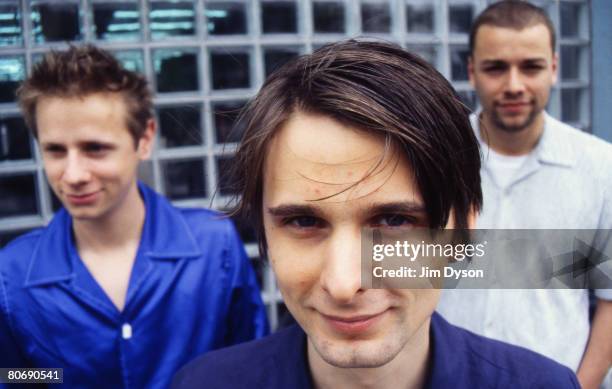 Matthew Bellamy , Dominic Howard and Christopher Wolstenholme of British rock group Muse pose, circa June 1999 as they promote their debut album...