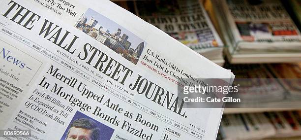 The U.S. Edition of The Wall Street Journal is displayed in front of British newspapers which it now sells alongside on a news stand in London on...