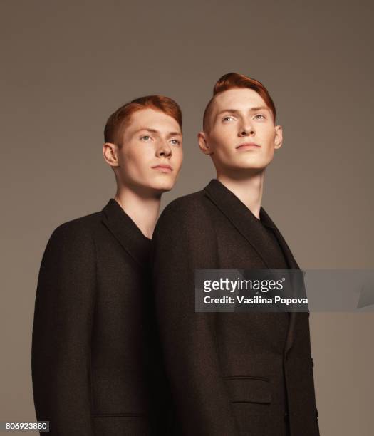 studio portrait of twins - twin stock pictures, royalty-free photos & images