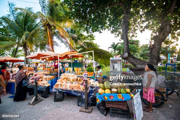 street market on playa del carmen selling gifts, fruits and snacks, mexico - mexican street market stock pictures, royalty-free photos & images