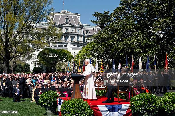 Pope Benedict XVI speaks as U.S. President George W. Bush listens during an arrival ceremony on the South Lawn at the White House April 16, 2008 in...