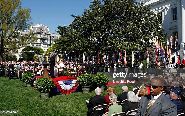 Pope Benedict XVI listens U.S. President George W. Bush speaks during an arrival ceremony on the South Lawn at the White House April 16, 2008 in...