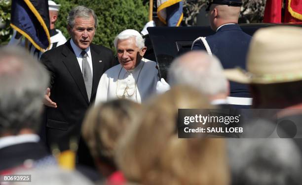 President George W. Bush escorts Pope Benedict XVI during welcoming ceremonies on the South Lawn of the White House in Washington, DC, on April 16,...