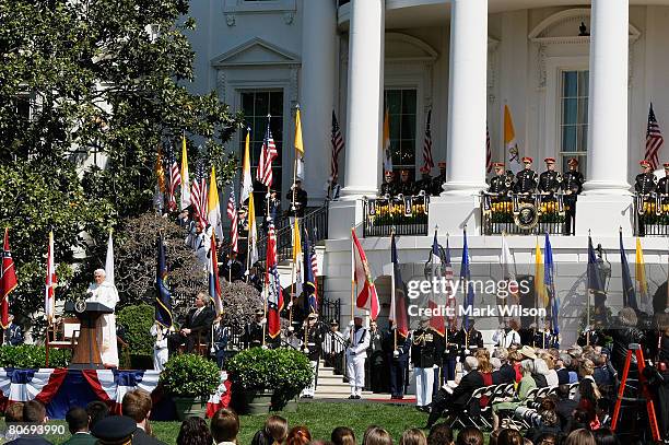 Pope Benedict XVI speaks during a arrival ceremony after being greeted by U.S. President George W. Bush on the South Lawn at the White House April...