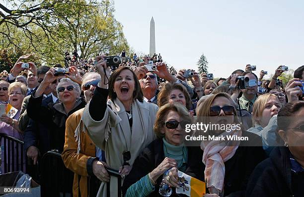 Guests react to Pope Benedict XVI as he speaks during an arrival ceremony with US President George W. Bush on the South Lawn at the White House April...