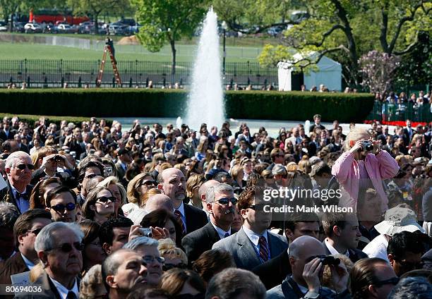 Guests watch to Pope Benedict XVI during an arrival ceremony with US President George W. Bush on the South Lawn at the White House April 16, 2008 in...