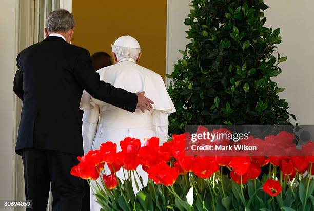 President George W. Bush and Pope Benedict XVI walk into the Oval Office after an arrival ceremony at the White House, April 16, 2008 in Washington,...