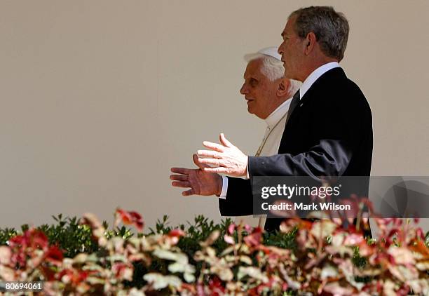 President George W. Bush walks with Pope Benedict XVI on the colonnade after a arrival ceremony ceremony at the White House, April 16, 2008 in...
