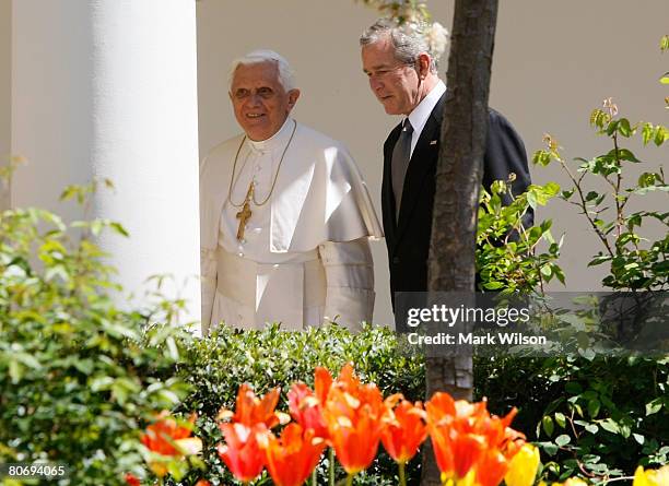 President George W. Bush walks with Pope Benedict XVI on the colonnade after a arrival ceremony ceremony at the White House, April 16, 2008 in...