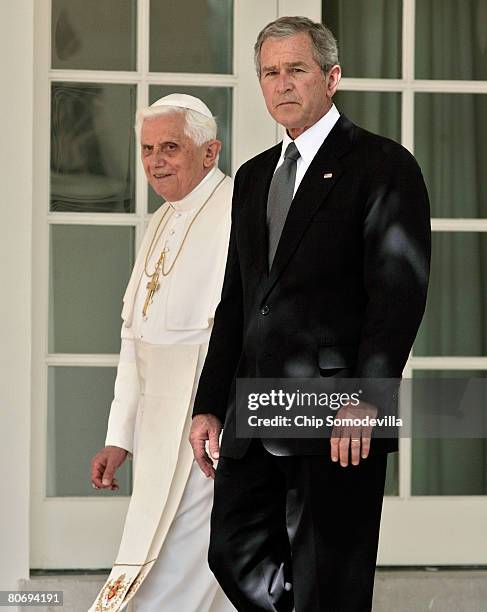 Pope Benedict XVI and U.S. President George W. Bush walk to the Oval Office along the Rose Garden colonnade at the White House April 16, 2008 in...