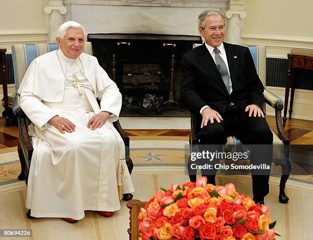Pope Benedict XVI and U.S. President George W. Bush pose for photographs in the Oval Office at the White House April 16, 2008 in Washington, DC....