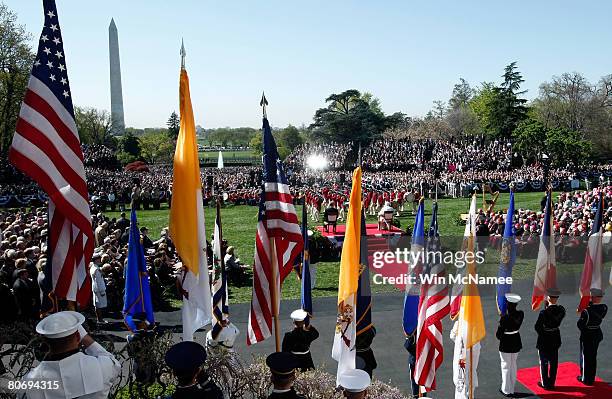 Pope Benedict XVI and U.S. President George W. Bush watch as Fife and Drum corps perform during an arrival ceremony at the White House April 16, 2008...