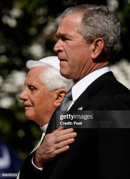 Pope Benedict XVI and U.S. President George W. Bush listen to the national anthem during an arrival ceremony on the South Lawn at the White House...