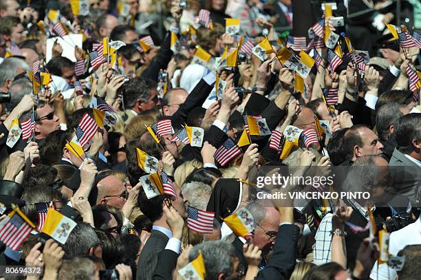 The crowd at the White house wave Vatican and US Flags during the welcoming ceremony for Pope Benedict XVI at the White House in Washington, DC, on...