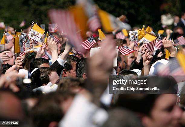 Waving U.S. And Vatican flags, about 12,000 people gathered on the South Lawn at the White House for the arrival ceremony of Pope Benedict XVI April...