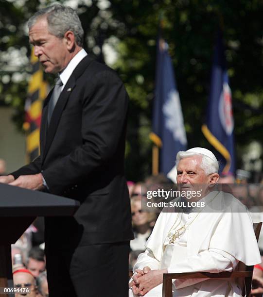 Pope Benedict XVI listens as US President George W. Bush speaks during welcoming ceremonies on the South Lawn of the White House in Washington, DC,...