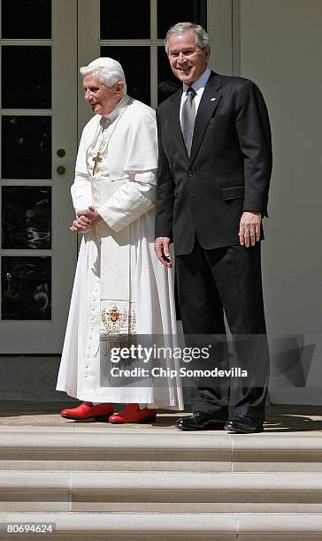 Pope Benedict XVI and U.S. President George W. Bush pause for photographers while walking to the Oval Office along the Rose Garden colonnade at the...