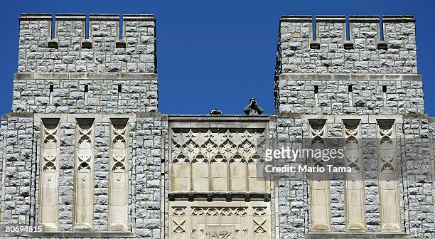 Security keeps watch from Burruss Hall during Virginia Tech's Day of Remembrance honoring the 32 people killed by Cho Seung-Hui April 16, 2008 in...
