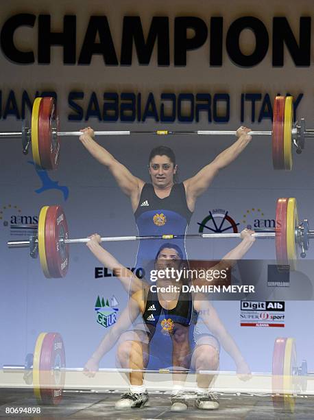 Gold medalist Armenia's Nazik Avdalyan competes in women 69 kg category during 2008 european weightlifting championships in Lignano Sabbiadoro on...