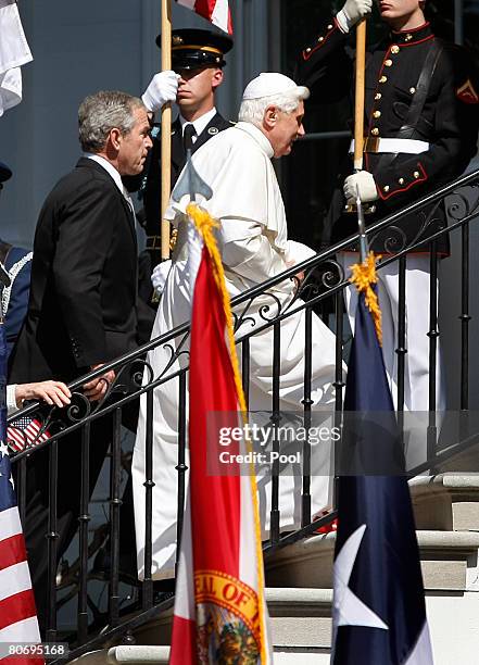 Pope Benedict XVI and U.S. President George W. Bush walk up stairs to the Truman Balcony following an arrival ceremony on the South Lawn at the White...