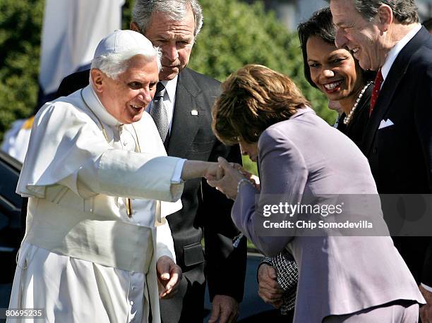 Speaker of the House Nancy Pelosi kisses the papal ring worn by Pope Benedict XVI as U.S. President George W. Bush , Secretary of State Condoleeza...