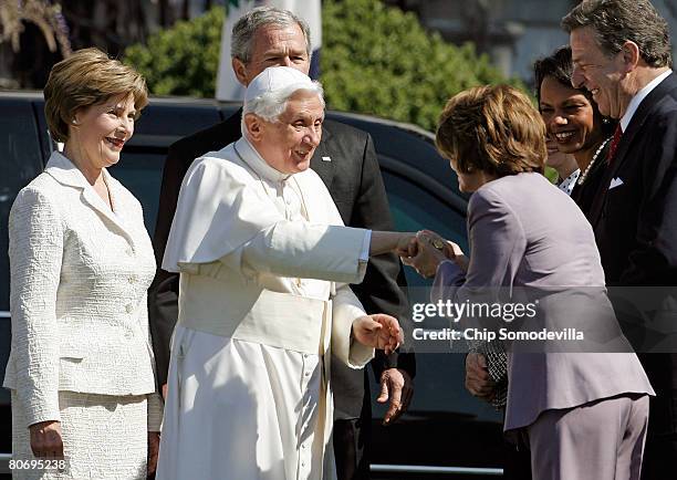 Speaker of the House Nancy Pelosi greets Pope Benedict XVI as first lady Laura Bush and U.S. President George W. Bush , Secretary of State Condoleeza...
