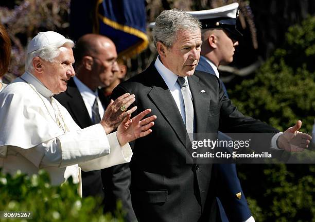 Pope Benedict XVI is guided by U.S. President George W. Bush during an arrival ceremony on the South Lawn at the White House April 16, 2008 in...